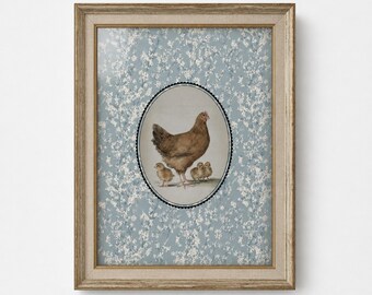 May include: A framed wall art piece featuring a central oval illustration of a brown hen with three small chicks. The background is a light blue pattern with white floral sprigs. The frame is a textured, light brown wood with a neutral border.