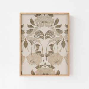 May include: A framed wall art print featuring a symmetrical, repeating botanical pattern in shades of beige, cream, and muted brown. The design displays stylized flowers and leaves with intricate line work, enclosed in a light-toned wooden frame.