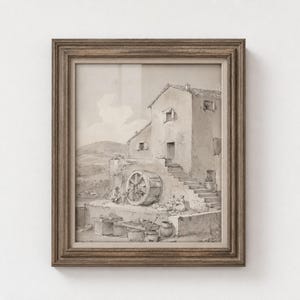 May include: A framed sepia-toned ink drawing depicting a rural scene with a stone building, a large wooden water wheel, and figures sitting on steps. The artwork is enclosed in a textured, dark brown wooden frame with a light-coloured inner border.