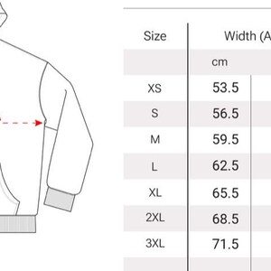 May include: Size chart for a hooded sweatshirt with measurements in inches and centimeters for width and length. Sizes range from XS to 3XL.