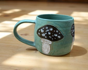 Turquoise mushroom ceramic mug