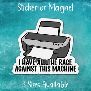 May include: A white sticker or magnet with a black and white illustration of a printer. The text "I have all the rage against this machine" is printed below the printer.