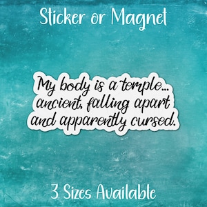 May include: A teal blue background with white text that reads "Sticker or Magnet" at the top and "My body is a temple... ancient, falling apart and apparently cursed." in the center. The text "3 Sizes Available" is at the bottom of the image.