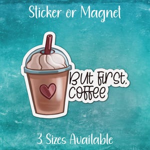 May include: A sticker or magnet featuring a cartoon illustration of a coffee drink with whipped cream and a straw. The text "But first, coffee" is written in a white outline on a blue background.