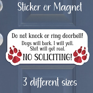 May include: White sign with red paw prints and the text "Do not knock or ring doorbell! Dogs will bark. I will yell. Shit will get real. NO SOLICITING!"  The sign is on a blue door.  Sticker or Magnet.