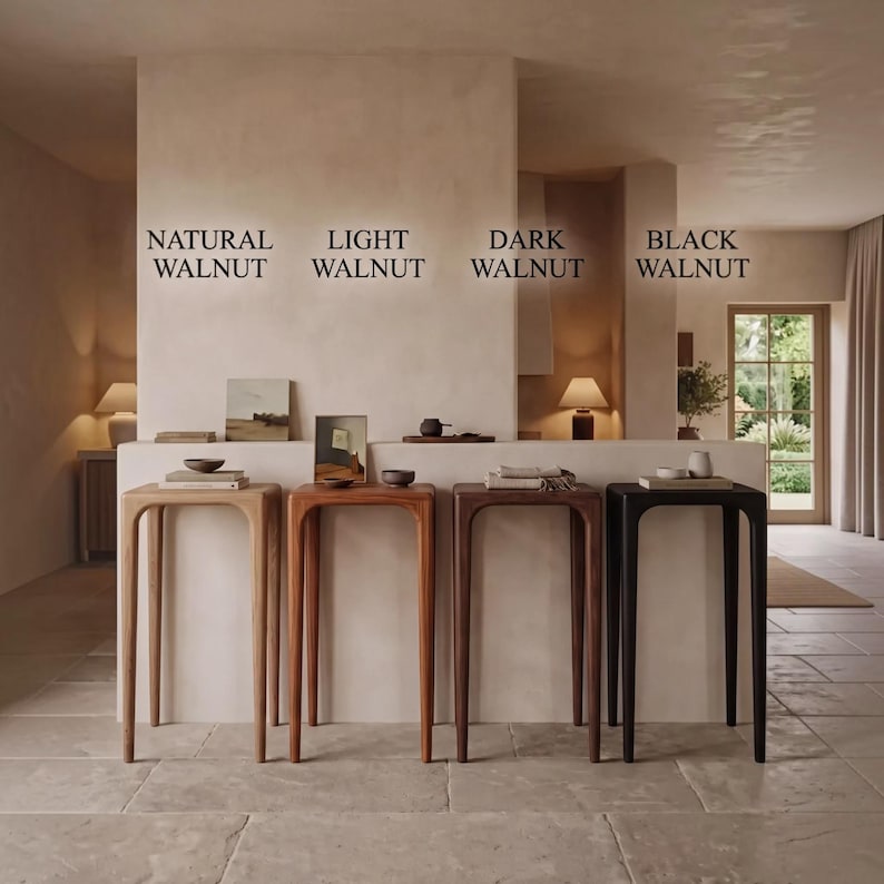 Puede incluir: Cuatro consolas de madera altas y delgadas dispuestas en fila, etiquetadas como Natural Walnut, Light Walnut, Dark Walnut y Black Walnut. Cada mesa presenta un dise&ntilde;o de marco arqueado liso con cuatro patas, mostrando tonos de madera distintos.