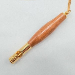 Wood Whistle with gold trim and gold chain.
