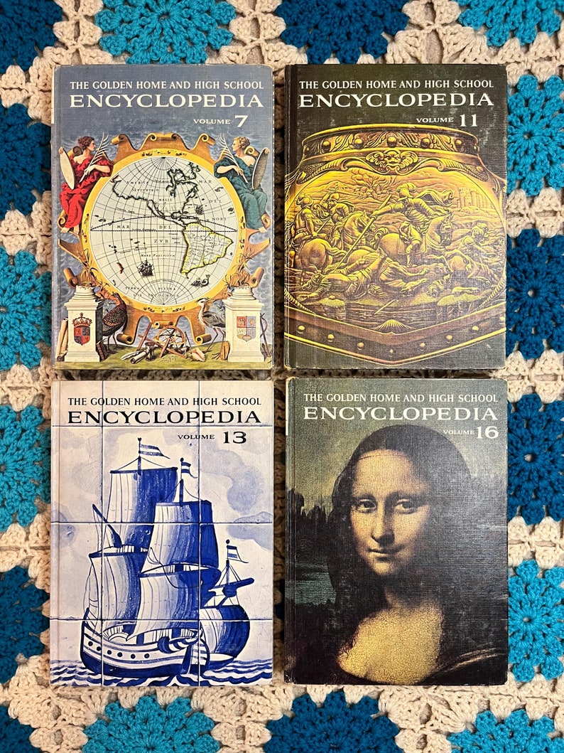 May include: Four vintage encyclopedias, volumes 7, 11, 13, and 16, are displayed. The covers feature illustrations of a world map, a golden urn with figures, a blue and white ship, and the Mona Lisa painting. The books are on a patterned surface.