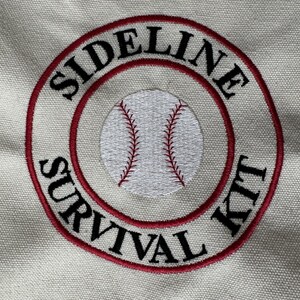 May include: Embroidered patch with the words "SIDELINE SURVIVAL KIT" in black, encircling a baseball graphic. The design features a red border and a baseball with red stitching, all on a beige fabric background.