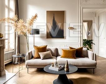 May include: A stylish living room featuring a beige sofa with mustard and beige cushions. An abstract artwork in a gold frame hangs above the sofa. A black coffee table and side table with gold details are also present, creating a modern aesthetic.
