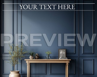 May include: A wooden console table with a light wood finish sits in front of a dark blue wall with white trim. The table has a rectangular top and two legs on each side. There are plants and a framed picture on the table. The wall has a decorative pattern of squares and rectangles. The floor is a light wood color. The text "YOUR TEXT HERE" is written in white on the wall.