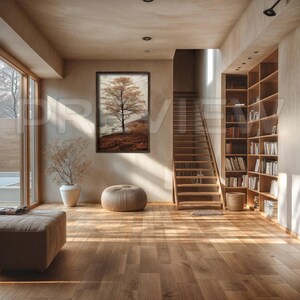 May include: A modern living room with a wooden staircase, a bookshelf filled with books, and a large framed print of a tree on the wall. The room has a light and airy feel with natural light streaming in from the windows.