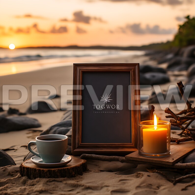 May include: A framed black chalkboard with the text "TOGWOR THEELLUMINARY.COM" on a beach setting with a lit candle and a cup of coffee.