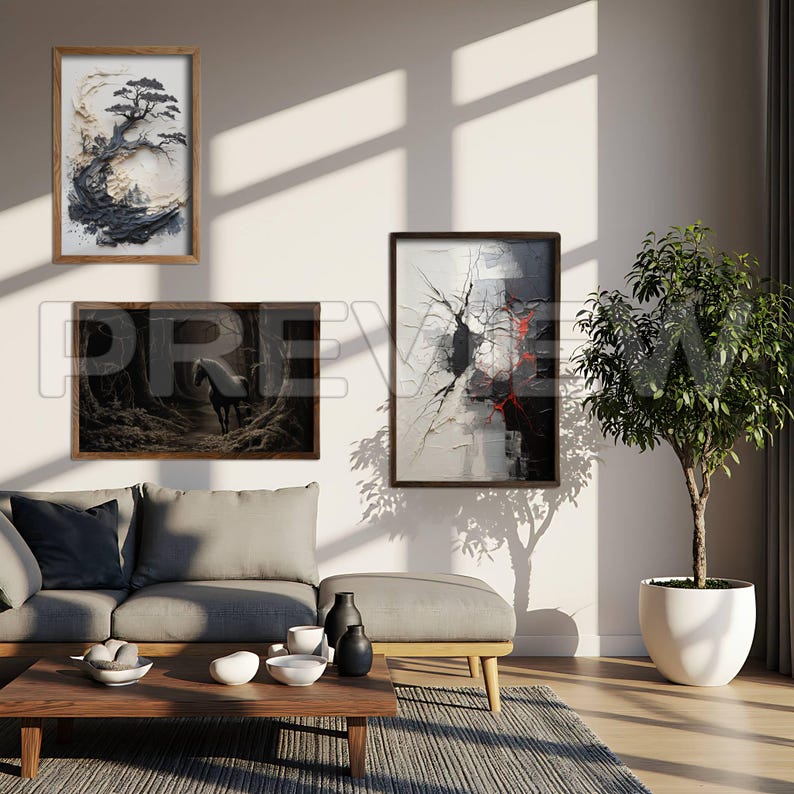May include: Three framed art pieces hang on a white wall above a gray sofa. The art includes an abstract tree, a horse in a forest, and an abstract painting with red accents. A small tree in a white pot sits to the right.