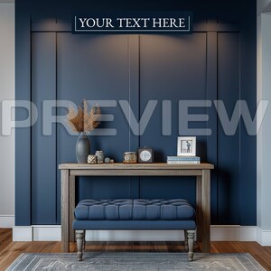 May include: A wooden console table with a blue upholstered bench in front of a dark blue wall with white trim. The table has a vase with dried flowers, candles, and a clock on top. The wall has the text "YOUR TEXT HERE" on it.