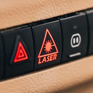Includes two, LASER (Medium Size) blank button decal sticker for cars.