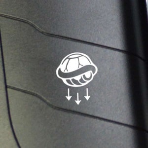 Small SHELL Button Decal Compatible with 911, 718, GTI, and other German Cars. Includes two fake button decal stickers per order.