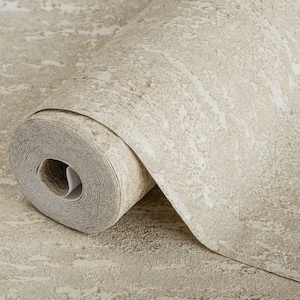 May include: A roll of beige textured wallpaper with a subtle shimmer. The wallpaper has a rough, stone-like appearance.