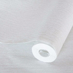 May include: A roll of white textured wallpaper. The wallpaper has a subtle, woven pattern.