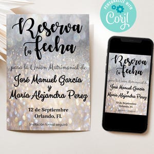 May include: A save-the-date card and a smartphone display the text "Reserva tu fecha" in elegant script. The card features a shimmering silver background with the names José Manuel García and María Alejandra Perez, and the date September 12th, Orlando, FL.