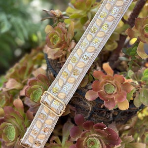 May include: A set of three ceramic mugs with a speckled, matte finish. The mugs are in shades of cream, light gray, and dark gray. Each mug has a simple, minimalist design, perfect for coffee or tea.