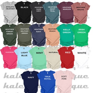 K&ouml;nnte beinhalten: Eine Auswahl an T-Shirt-Farben, darunter Athletik-Heather, Schwarz, Heather Dunkelgrau, Heather Tiefblau, Heather Weinrot, Heather Lila, Heather Waldgr&uuml;n, Heather Milit&auml;rgr&uuml;n, Heather Marineblau, Heather Pfirsich, Kellygr&uuml;n, Irischgr&uuml;n, Himbeere, Hellblau, Minze, Natur, Rot, Wei&szlig;, Marineblau, Royalblau und Rosa.