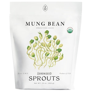 May include: A white bag of Sereniseed Mung Bean Sprouts. The bag features the text "MUNG BEAN" and "SPROUTS" in bold black letters. A watercolor illustration of sprouts is in the center. The bag contains 16 oz. of sprouts.