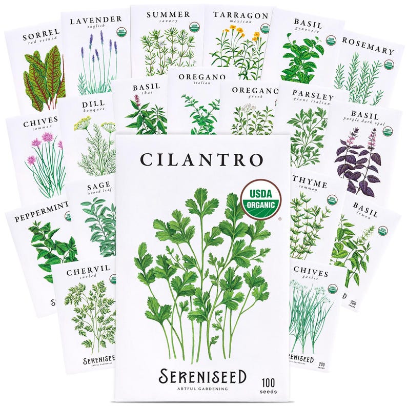 May include: A collection of white seed packets featuring botanical illustrations of various herbs including cilantro, lavender, basil, rosemary, and thyme. Each packet displays the plant name, a USDA Organic seal, and the brand name Sereniseed.