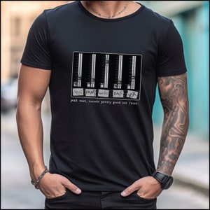 May include: Black t-shirt featuring a graphic of a soundboard with faders and the text "Keys, Drums, Guitars, Bass, Vox" and "yeah man, sounds pretty good out front."