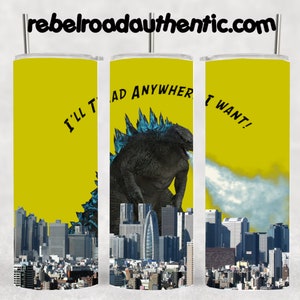 May include: A yellow stainless steel tumbler with a Godzilla graphic and the text "I'll tread anywhere I want!" printed on it. The tumbler is surrounded by a cityscape.