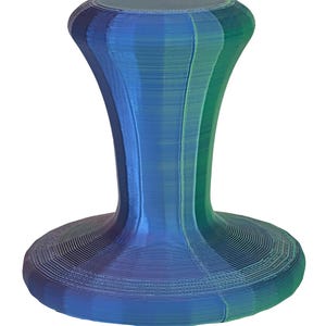 May include: A 3D-printed bottle stopper with a layered design. The stopper features a wide, circular base, a slender, curved neck, and a rounded top. The color gradient transitions from blue to green.