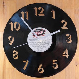 Handmade wall clock made from recycled 33 rpm vinyl record. Original clock.
