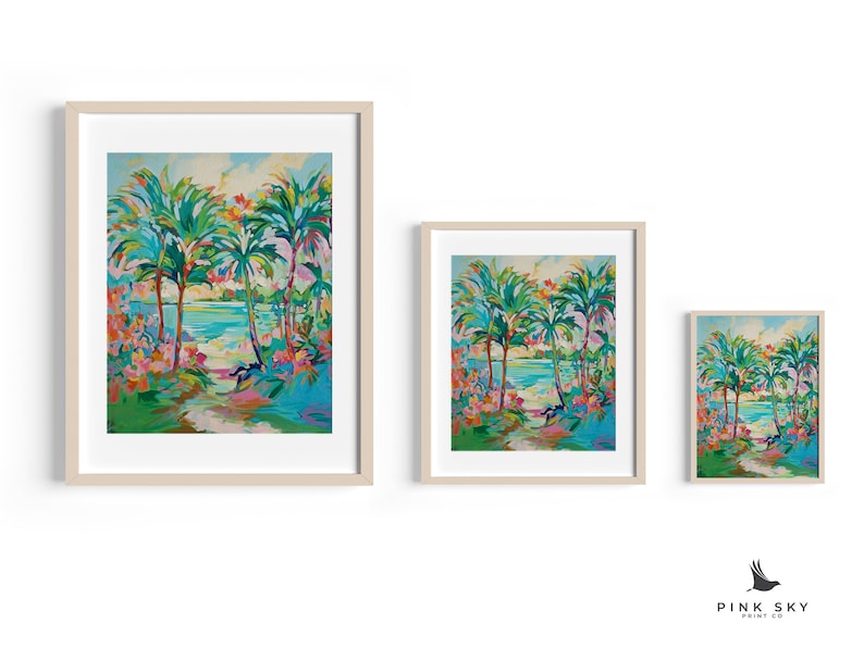 May include: Three framed prints of a tropical scene with palm trees, a blue body of water, and a path leading to the water. The prints are in different sizes, with the largest print on the left and the smallest print on the right.