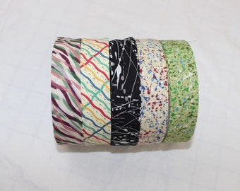 Bias Binding (Tape) 25mm, Cotton,  Single Fold. Fusible iron on available. swirls, splats and wavey lines.