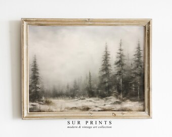 May include: A framed painting of a foggy forest scene with tall pine trees in shades of gray and white. The frame is a light wood color.