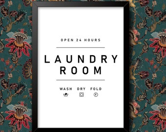 May include: Black framed sign with white text that reads "Open 24 Hours Laundry Room" with icons for wash, dry, and fold.