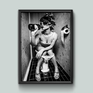 Funny retro-style bathroom photo – woman with curlers and sunglasses drinking on toilet, black and white wall art