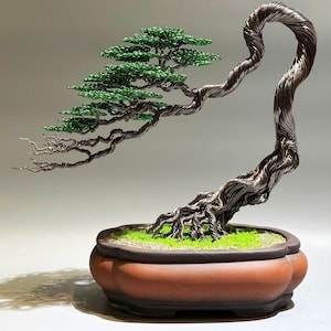 May include: A wire sculpture of a bonsai tree with a green foliage and a brown pot. The tree is made of twisted wire and has a realistic appearance.