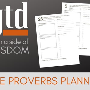 May include: A black and white planner with the text "gtd with a side of WISDOM" and "THE PROVERBS PLANNER". The planner has a daily layout with sections for appointments, priorities, action steps, and gratitude. The text "FOR A MAN'S WAYS ARE BEFORE THE EYES OF THE LORD, AND HE PONDERS ALL HIS PATHS. PROVERBS 5:21" is at the top of the page.