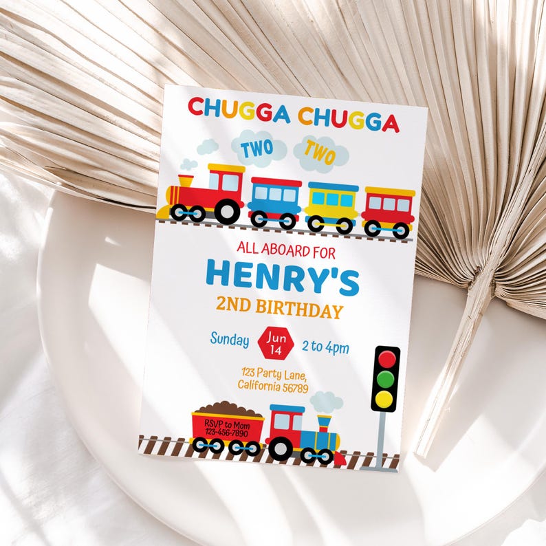 May include: A colorful train-themed birthday invitation for a 2nd birthday party. The invitation features a red, yellow, and blue train with the text "Chugga Chugga Two Two" and "All Aboard for Henry's 2nd Birthday". The invitation also includes a date and time for the party, as well as an RSVP phone number.