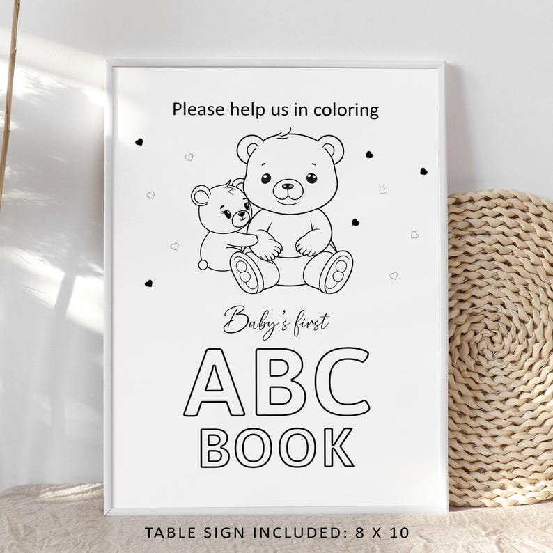 May include: A framed black and white sign with the text "Please help us in coloring" and "Baby's first ABC BOOK". The sign features illustrations of two teddy bears and small hearts. The sign measures 8 x 10 inches.