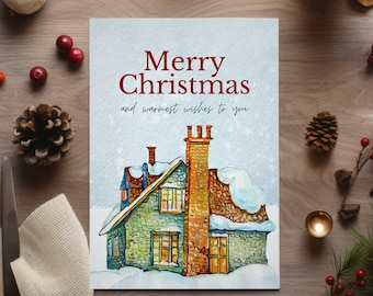 May include: A Christmas card with a watercolor illustration of a house with snow on the roof. The card reads "Merry Christmas and warmest wishes to you".