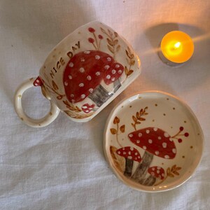 handmade mushroom mug
• whimsical ceramic cup
• toadstool mug
• fairy forest mug
• fantasy pottery
• nature inspired mug
• red mushroom cup
• sculptural handle mug
• cottagecore ceramic
• fungi mug
• handmade tea mug
• forestcore kitchenware
• unique ceramic art