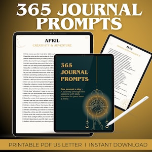 May include: A digital download of 365 journal prompts, one for each day of the year. The prompts are organized by month and theme, with a focus on creativity, adventure, introspection, and presence. The image shows a digital tablet displaying the April prompts, with the text "365 Journal Prompts" and "One prompt a day - A Journey through the seasons with daily wisdom for your heart & mind" visible.