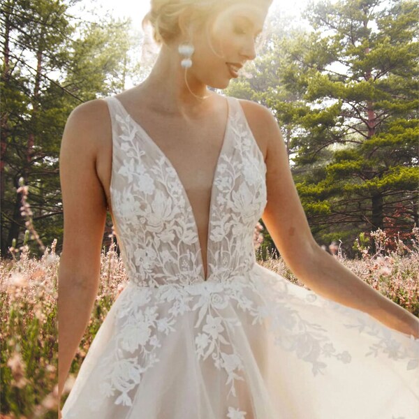 Elegant A-Line Wedding Dress: Deep V-Neck, Spaghetti Straps & Tulle Train