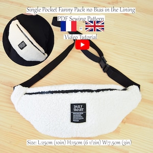 May include: White faux fur fanny pack with a black zipper and strap. The pack has a black label with the text "DAILY SMART" on it. The pack measures 10 inches long, 6 1/2 inches high, and 3 inches wide.