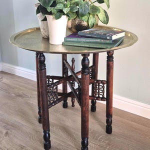 Vintage brass tray top table with lovely folding carved wooden base
