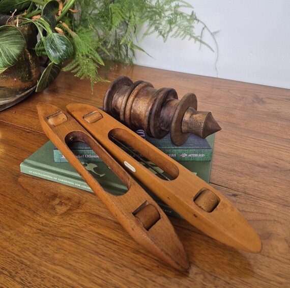 Vintage pair of solid wooden loom shuttles and 3 wooden bobbins/spools on holder- lovely aged colour and patina. For sale separately