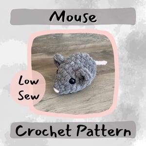 May include: A crochet pattern for a gray mouse with a pink tail. The pattern is called "Low Sew Mouse Crochet Pattern".
