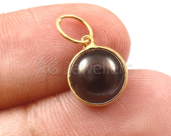 Dije de perla negra hecho a mano en oro de 18 quilates: delicado colgante de oro